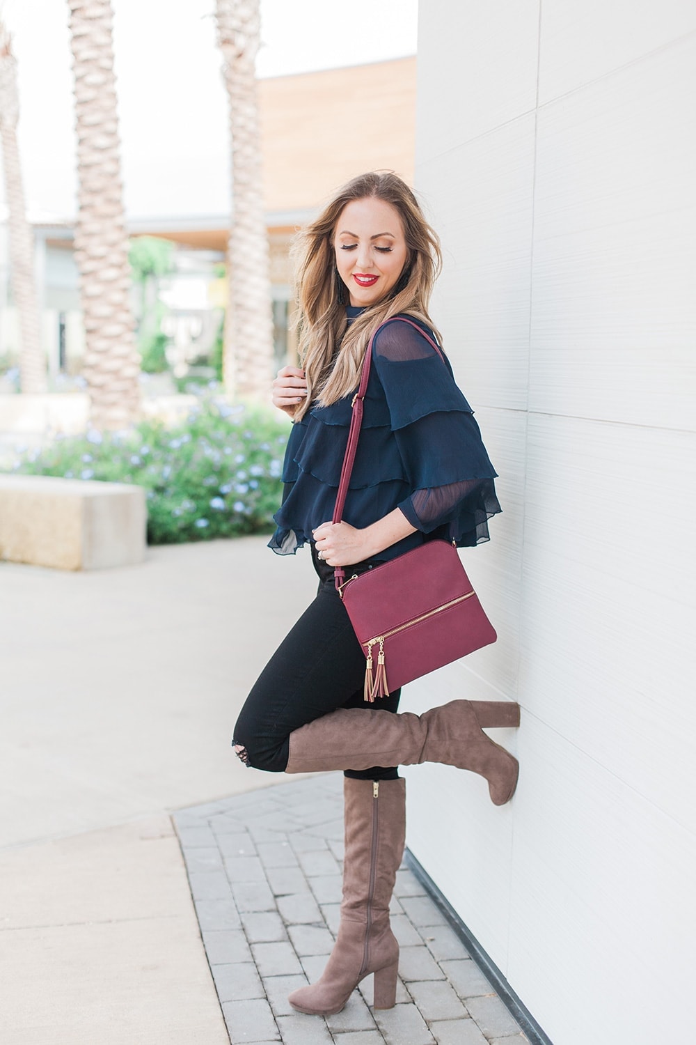 navy ruffle blouse with boots - perfect fall or holiday outfit