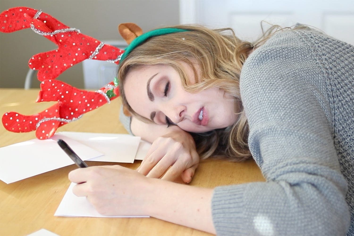 falling asleep while addressing Christmas cards - holiday bloopers by Houston blogger Meg O. on the Go