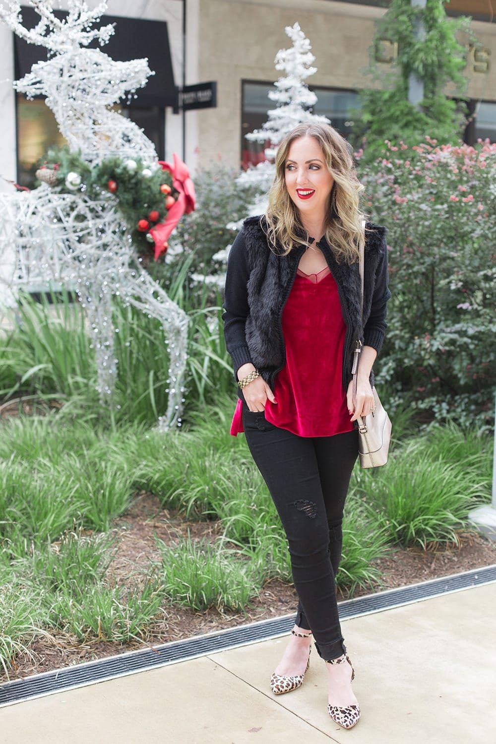 Holiday outfit idea - velvet tank, fur, black denim, and leopard block heels