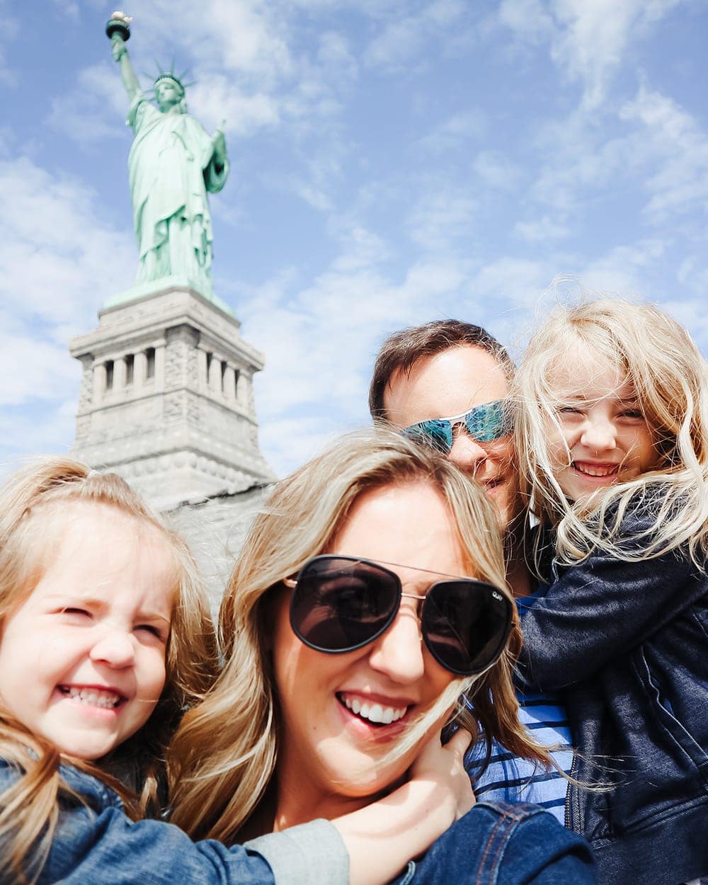 Statue of Liberty Family Photo - New York City Family Trip guide by mommy blogger Meg O. on the Go