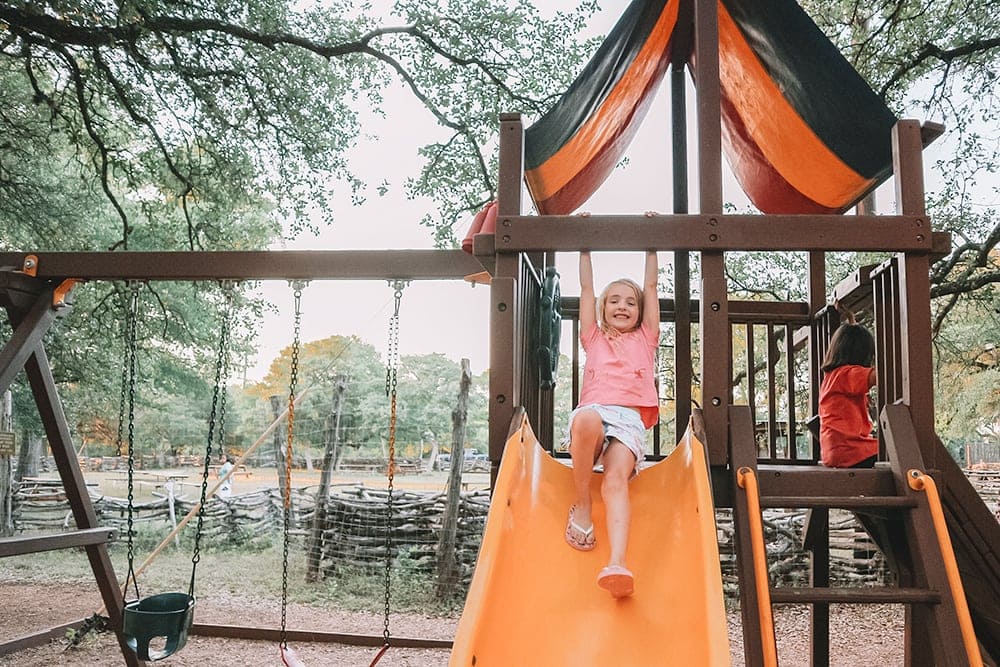 The Salt Lick BBQ in Driftwood, TX is the perfect family-friendly restaurant to visit. We love the playground!