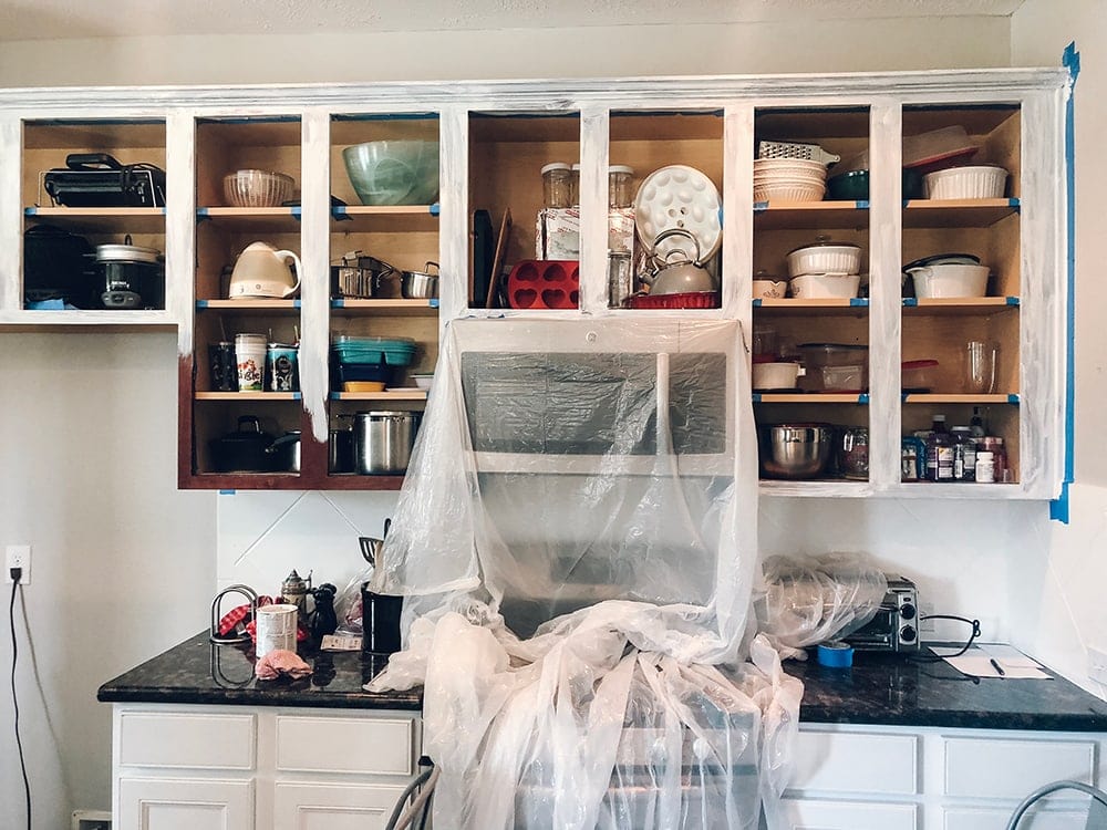 Houston blogger Meg O. on the Go shares how she painted her entire kitchen for under $250 - she painted her kitchen cabinets in sections