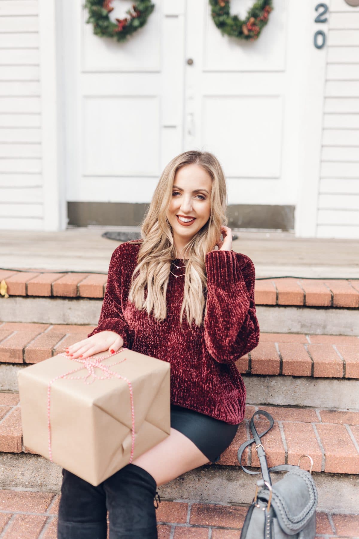 Houston blogger Meg O. on the Go shares a holiday outfit idea with a chenille sweater, faux leather skirt, and over the knee boots - all from Evereve