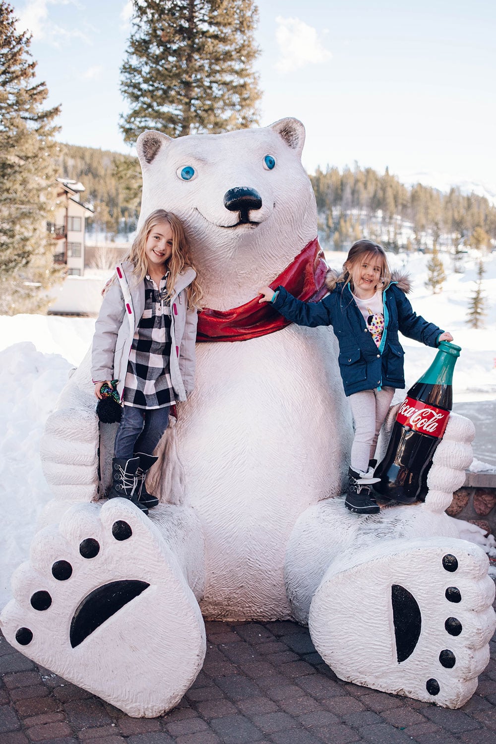 Houston blogger Meg O. shares her ski trip with kids to Winter Park Colorado - the Winter Park Resort village is so cute with the Coca Cola Bear