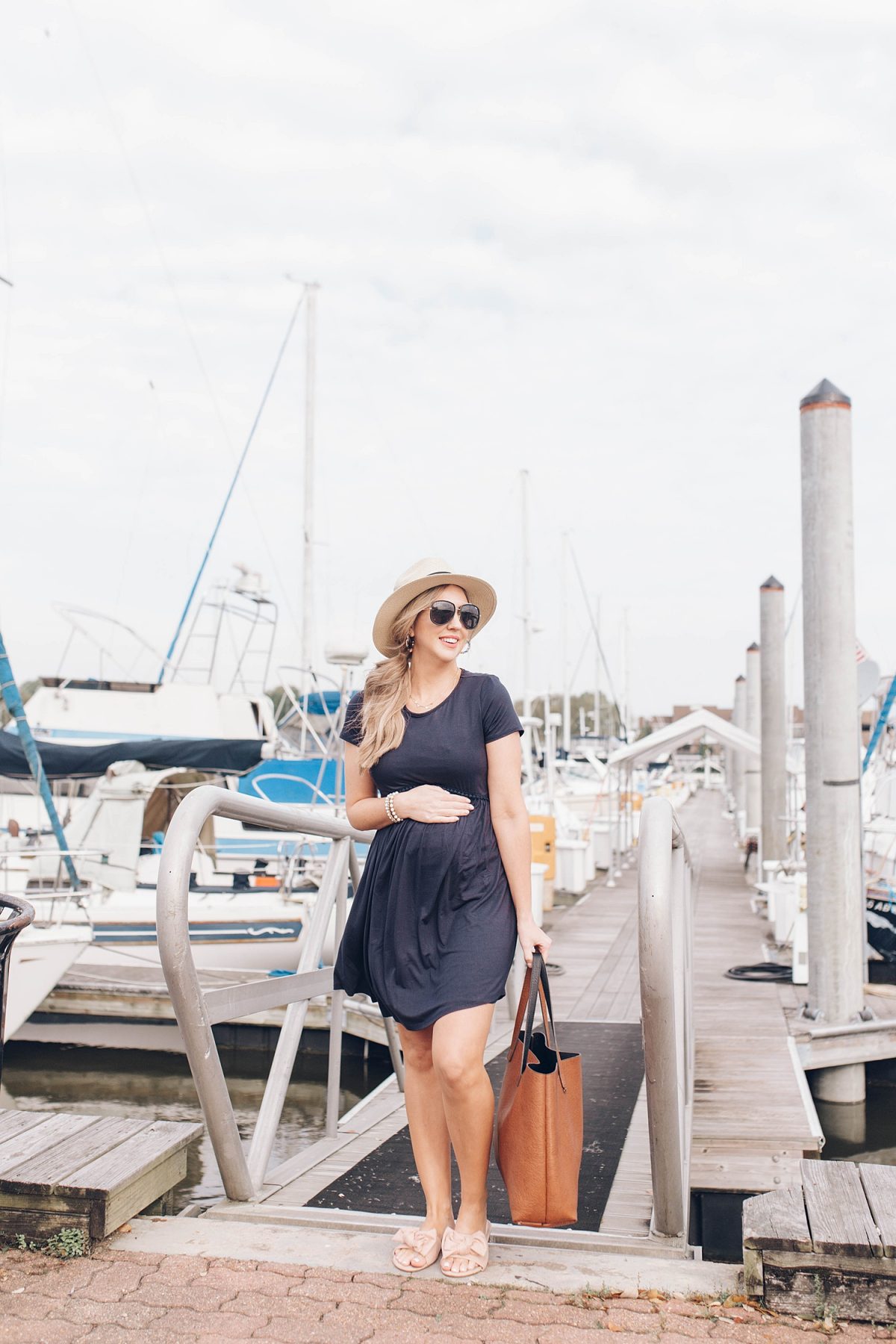 Houston lifestyle blogger Meg O. on the Go shares her favorite spring maternity dresses - this navy solid crochet trim dress is perfect for spring and summer!
